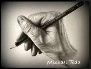 Artist Michael Todd's hand holding a graphite pencil